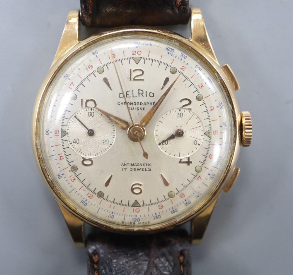 A gentlemans 18k Delrio chronograph manual wind wrist watch. case diameter 38mm, gross 45.9 grams.